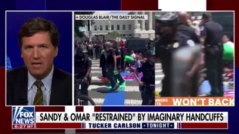 Tucker Carlson mocks how AOC and Ilhan Omar were led away by police in imaginary handcuffs!!