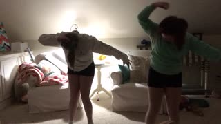 Two Teens Dance To Music Until One Trips Over A Toy