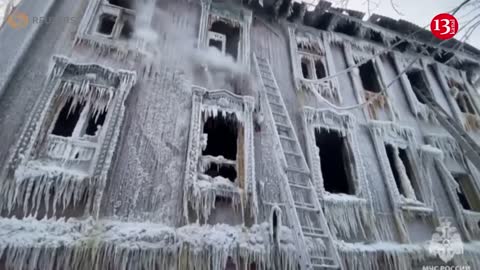 House left encrusted with icicles after Russia firefighters tackle deadly blaze in bitter cold