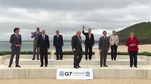 Emmanuel Macron and Joe Biden share a moment after G7 leaders' photo