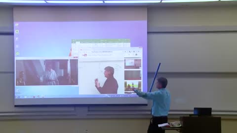 Epic Prank: Math Professor's Hilarious Battle with Projector Screen Goes Viral!