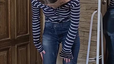Trying on very tight jeans