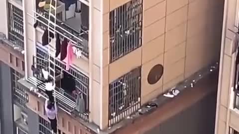 Shanghai residents are fleeing from apartments by rope ladders