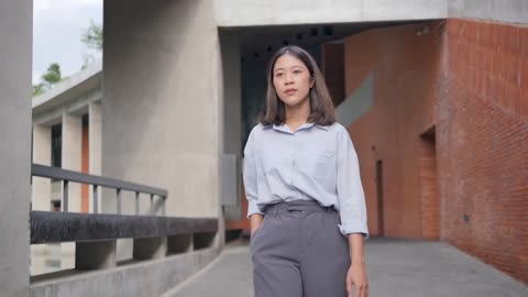 Young pretty Asian girl walking