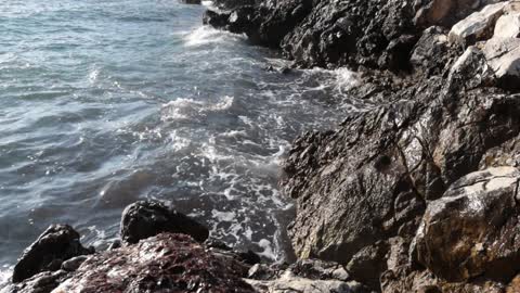 Sea Waves Crashing on Rocky Shore