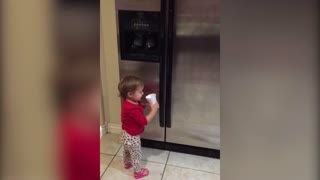 A Little Girl Misses Her Mouth While Drinking From A Cup