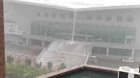 Rain turns university gymnasium stairs into waterfalls in China