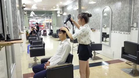 Relaxing shampoo with cute young girl in vietnam barbershop