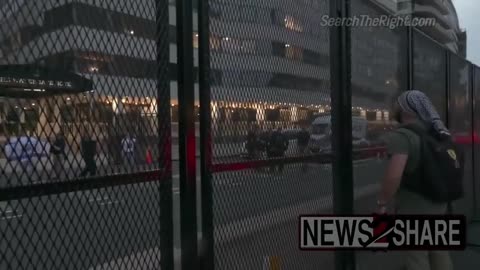 Hamas supporter in front of the Watergate Hotel yells at Israel supporters