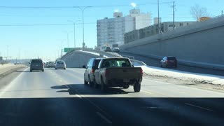 Truck Pushes Car Down Freeway