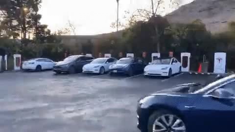 Tesla charging line in California. 30-60 mins per charge.