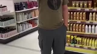 A man follows a woman around a store for not wearing a mask