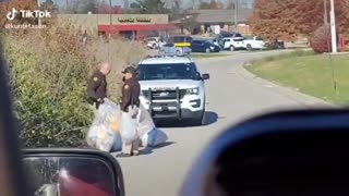 Police officers find thousands of mail-in ballots dumped in field beside dirt road