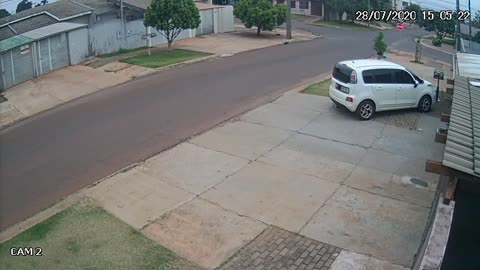 Car T-Bones Police Car and Narrowly Misses Pedestrian