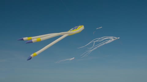 Octopus kites against a blue sky