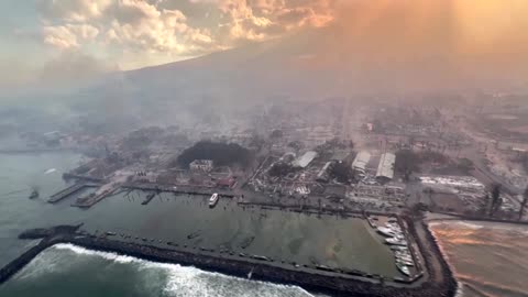 Aerial video over Maui shows smoke rising from fire