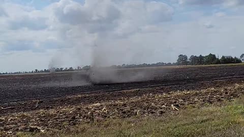 Dust Devil Moves Through Harvested Corn Field