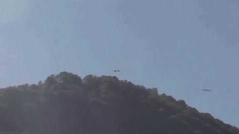 UFO Lurking Behind Mountain Caught On Video
