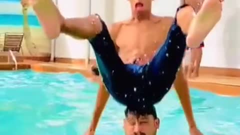 GUY JUMPS ON HEAD IN POOL