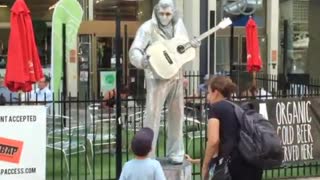 Silver Elvis and a little boy.... Cool!!!!!!