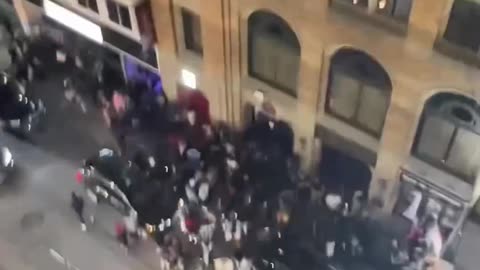 Person Throws Red Bull bottle Off Building And It Hits Woman in The Face