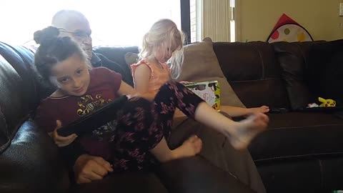 Claire Reads to Dad and Grace