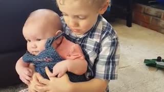 Sweet Little Boy Preciously Sings To His Baby Sister