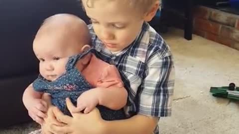 Sweet Little Boy Preciously Sings To His Baby Sister