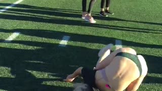 Football field girl fails backflip