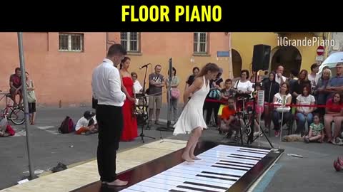 Professional dance on giant floor piano