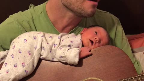 Dad Serenades Newborn Baby To Sleep On Guitar