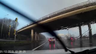 Tornado Sends Shed Panels Floating over Motorway