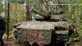 Ukraine's Zelenskiy inspects tanks on the frontline