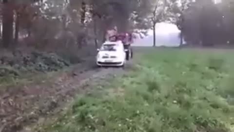 Dutch Farmer allegedly towing Dutch Police Car