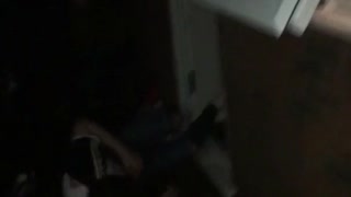 Guy tries to climb out second floor window and falls onto front door dark