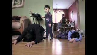 Toddler Boy Does Yoga With His Mom, Stomps Her Hand