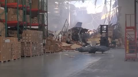 Fighter Jet Just Crashes Through Warehouse Wall