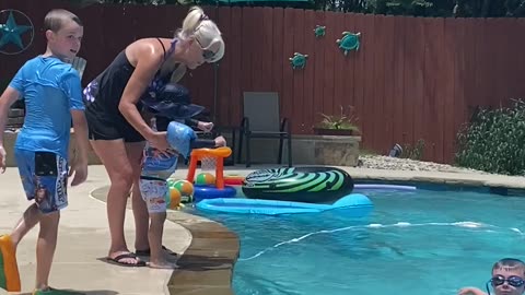 MareBear helping our youngest grandson overcome his fear of jumping into the pool.