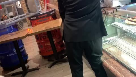 Irate Man Destroys Pizza Display