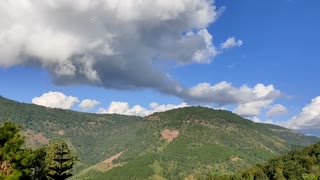 Lovely garden in front of the beautiful mountain and sky