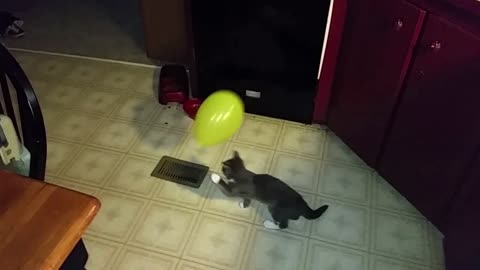 Baby Kiplynn playing with a balloon.