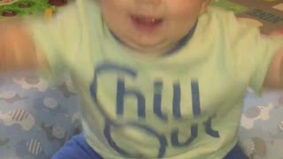 Baby so excited to be on camera he falls over!