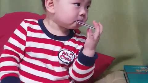 A baby who eats cards