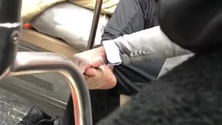 Man gives himself foot rub on subway train, bare foot