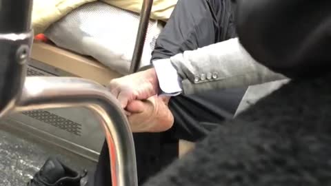 Man gives himself foot rub on subway train, bare foot