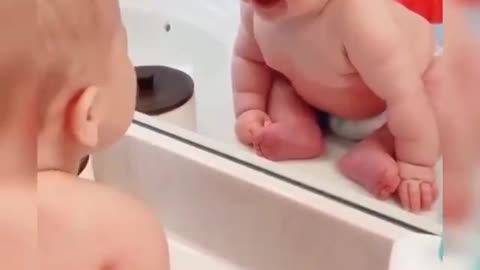 The wonderful shots show the first meeting of the child in a mirror