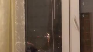 beautiful fireworks, watching from the window