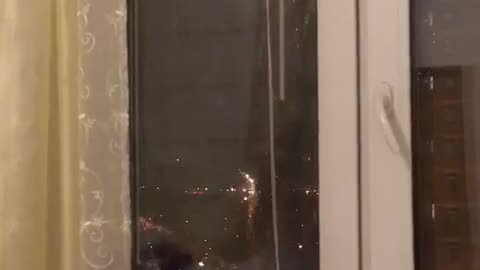 beautiful fireworks, watching from the window