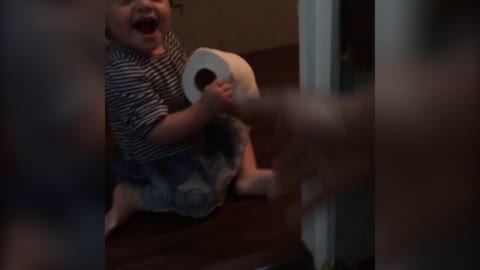 Baby Girl Refuses To Give Dad The Toilet Paper He Needs