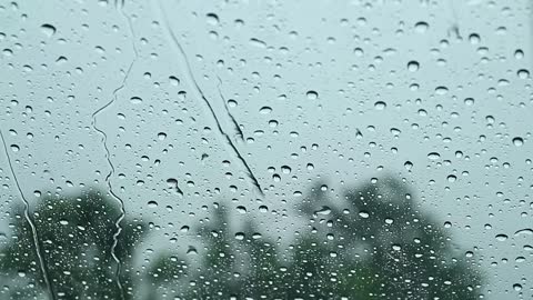 Rain falling on a car window